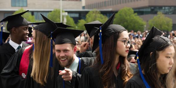 Students from the Major in Information Systems program line up in their caps and gowns before the ceremony.