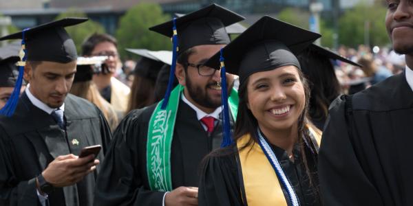 Graduates of the Major in Risk Management and Insurance program celebrate at a ceremony.