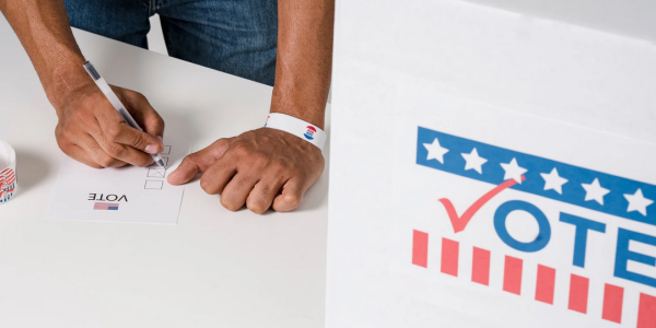 Person filling out a voting ballot