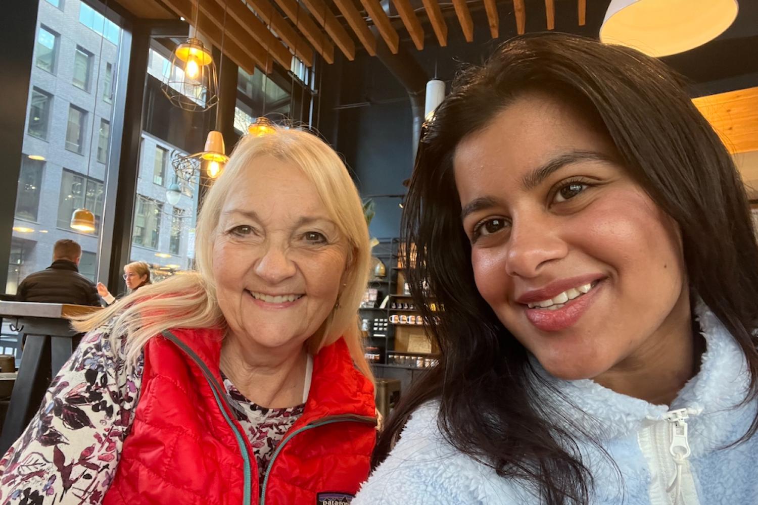 Mentee, Aanchal Acharya, and mentor, Maggie Bolden, smile for a photo during a mentorship meeting