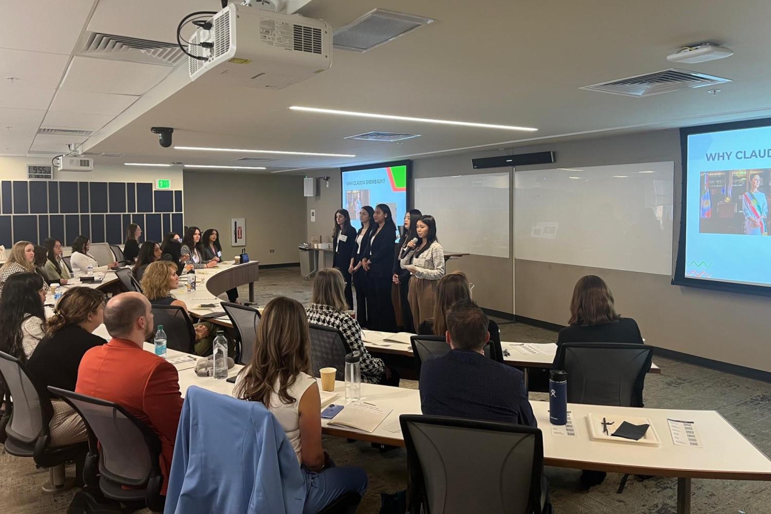 Students presenting their learnings to peers, mentors, and business executives at the semester-end symposium